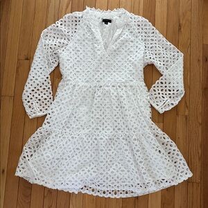 J Crew white eyelet dress lined with full flouncy skirt. Split neck size S